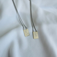 0604283300 - ESCAPLARIO AO INOX SAG. CORAO E NOSSA SEN. DO CARMO<br>QTDE PCT: 5 PC - VAL PCT: R$ 39,95 - PESO UNIT: 5,700g